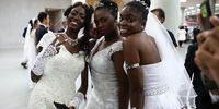 GAPYEONG-GUN, SOUTH KOREA - AUGUST 27:  Brides waiting in the queue during an wedding ceremony of the Family Federation for World Peace and Unification, commonly known as the Unification Church, at Cheongshim Peace World Center on August 27, 2018 in Gapyeong-gun, South Korea. Some 4,000 'Moonies', believers of Unification Church, which was named after the founder Moon Sun Myung, attend the mass wedding which began in the early 1960s. (Photo by Chung Sung-Jun/Getty Images)