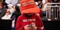 MANCHESTER, NH - FEBRUARY 10: A supporter of U.S. President Donald Trump wears an oversize "Make America Great Again Hat" as he waits for the start of a "Keep America Great" rally at Southern New Hampshire University Arena on February 10, 2020 in Manchester, New Hampshire. New Hampshire will hold its first in the national primary on Tuesday. (Photo by Drew Angerer/Getty Images)