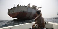 A Yemeni looks at FSO Safer oil tanker in the Red Sea, off the coast of the western Hodeidah province, Yemen, 12 June 2023. The United Nations has started salvage work on FSO Safer oil tanker with over one million barrels of crude oil that pose an acute risk to the environment with the possibility of it breaking apart or catching fire. The 47-year-old vessel has not been serviced since Yemen's war broke out in 2015 and was left abandoned off the Houthis-held port of Hodeidah in the Red Sea.  EPA-EFE/YAHYA ARHAB