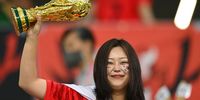A Korea Republic fan shows their support with a model FIFA World Cup trophy prior to the FIFA World Cup Qatar 2022 Group H match between Korea Republic and Portugal at Education City Stadium on December 02, 2022 in Al Rayyan, Qatar. (Photo by Claudio Villa/Getty Images)