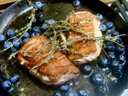Pan-fried duck breasts with blueberry-cherry sauce and a touch of ginger beer