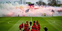 Supporters of Feyenoord light flares during a public training session at the Varkenoord Sports Complex in Rotterdam, The Netherlands, 06 April 2024, on the eve of the Eredivisie match against Ajax.  EPA-EFE/ROBIN UTRECHT