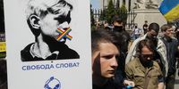 epa09247167 Activists of the civil movement 'Traditions and order' attend a rally in front of the Presidential office in Kiev, Ukraine, 04 June 2021. Protestors gathered to protest against law draft 5488 which provide administrative or criminal liability for the grounds of racial, national or religious intolerance also as a criticism of LGBT (Lesbian, Gay, Bisexual, and Transgender) movements in Ukraine and involves imprisonment up to eight years.  EPA-EFE/SERGEY DOLZHENKO