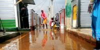 Floodwater between shacks at the . (Photo: Bheki Simelane)