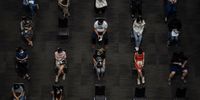 BANGKOK, THAILAND - JUNE 07: People are seen taking seats while waiting to get administered the AstraZeneca Covid-19 coronavirus vaccine by health workers at the mass vaccination site inside the Siam Paragon shopping mall on June 07, 2021 in Bangkok, Thailand. Thailand began rolling out its long-anticipated mass vaccination program on Monday. The government has said it will vaccinate around 70 percent of its population by the end of the year, with either  Sinovac or AstraZeneca vaccines. The government has also announced plans to acquire Pfizer and Johnson &amp; Johnson vaccines to bolster its program. (Photo by Sirachai Arunrugstichai/Getty Images)