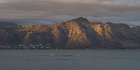 [Sunrise over Gordon's Bay mountains]. Photographer: [Pete van der Spek].