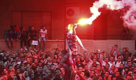 Egyptians angry at film scale U.S. embassy walls