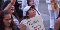 LOS ANGELES, CA - JUNE 30: People demonstrate and call out words of encouragement to detainees held inside the Metropolitan Detention Center after marching to decry Trump administration immigration and refugee policies on June 30, 2018 in Los Angeles, California. Although President Trump was forced to reverse his policy of removing all children from their immigrant or asylum-seeking parents, little clarity appears to be seen as to how agencies can fulfill a court order to reunite thousands of children and parents detained far apart by multiple agencies. Yesterday, the Justice Department filed papers in a Los Angeles federal court to have families arrested for illegal border crossings incarcerated together indefinitely. The rally is one of more than 700 such protests being held throughout the nation.  (Photo by David McNew/Getty Images)