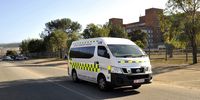 A state ambulance leaves Uitenhage Provincial Hospital in Nelson Mandela Bay. (Photo: Mike Holmes)