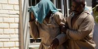 Zimbabwean church leader Madzibaba Ishmael Chokurongerwa (L) covers his head during trial over minors abuse charges at the Norton Magistrate Court in Norton, Zimbabwe, 19 March 2024. Chokurongerwa, a 'self-styled' prophet and church leader as well as seven of his associates, were all denied bail on the grounds that the accused are people of influence in their community and the likelihood of them interfering with witnesses is very high. They were arrested after the police raided their farm, also used as a shrine, on 12 March 2024 for criminal activities which include abuse of minors, according to a statement by the Zimbabwe Republic Police. A total of 246 out of 251 children below the age of 18 found at the farm had no birth certificate and were being used to perform various physical activities for the sect’s leadership, police said. Police established that all children of school-going age did not attend formal education and were subjected to abuse as cheap labor, doing manual work in the name of being taught life skills. Police also found 16 unregistered graves, including seven for infants.  EPA-EFE/MUNASHE CHOKODZA