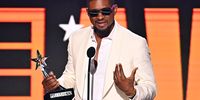 LOS ANGELES, CALIFORNIA - JUNE 30: Usher accepts the Best Male R&amp;B/Pop Artist award onstage during the 2024 BET Awards at Peacock Theater on June 30, 2024 in Los Angeles, California. (Photo by Paras Griffin/Getty Images for BET)