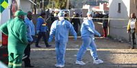 Forensic pathologists outside the Enyobeni Tavern in Scenery Park, East London. (Photo: Supplied)