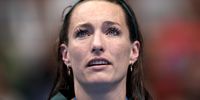 NANTERRE, FRANCE - JULY 29: Gold Medalist Tatjana Smith of Team South Africa reacts on the podium during the Swimming medal ceremony after the Women’s 100m Breaststroke Final on day three of the Olympic Games Paris 2024 at Paris La Defense Arena on July 29, 2024 in Nanterre, France. (Photo by Sarah Stier/Getty Images)