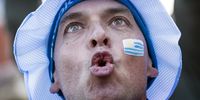 An Uruguay supporter reacts while watching the FIFA World Cup 2018 group A preliminary round soccer match between Uruguay and Saudi Arabia in the Fan zone in St.Petersburg, Russia, 20 June 2018.  EPA-EFE/ETIENNE LAURENT