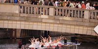 epa09260827 Dancers of the Staatsballett Berlin ballet company perform on an excursion boat on the river Spree as they pass under a bridge full of spectators in Berlin, Germany, 10 June 2021. After a period of closed cultural institutions due to the coronavirus COVID-19 pandemic, theaters and opera houses are reopening again with reduced admission of spectators. The Staatsballett Berlin (Berlin State Ballet) performed excerpts from their repertoire, while could spectators followed the boat through the inner city of Berlin.  EPA-EFE/CLEMENS BILAN